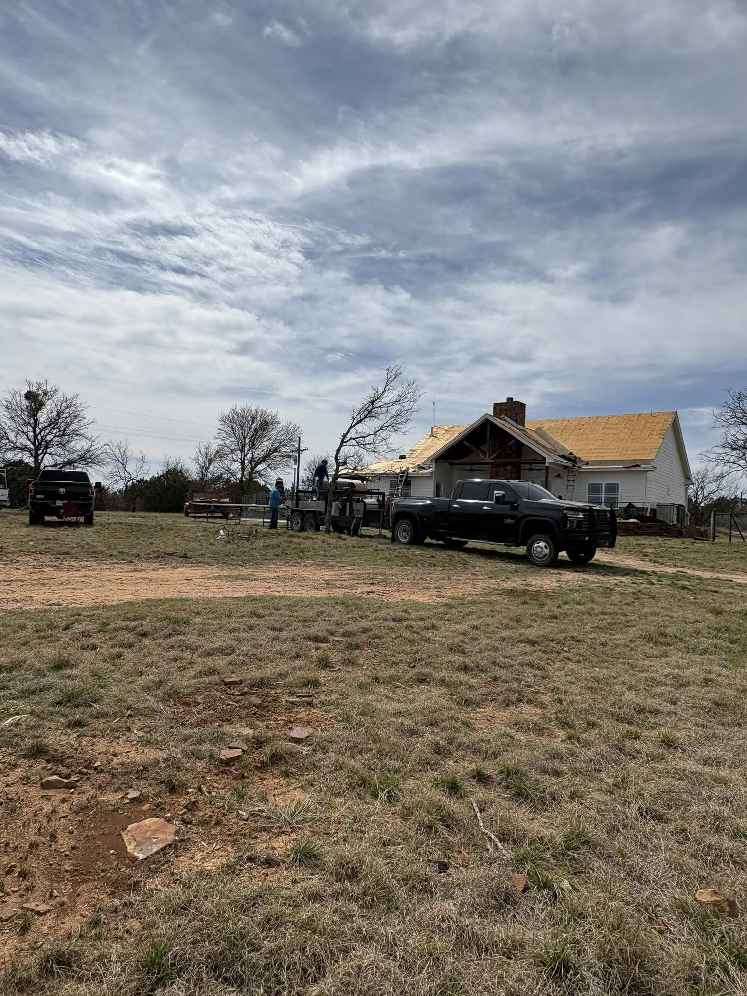 House with exposed roof deck during full replacement